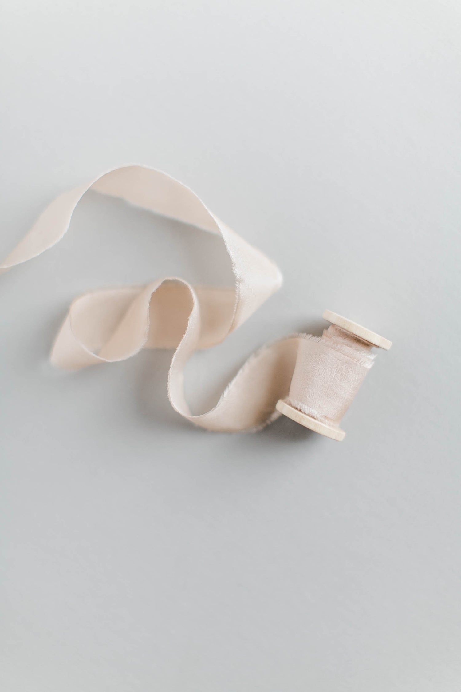 roll of frayed ribbon